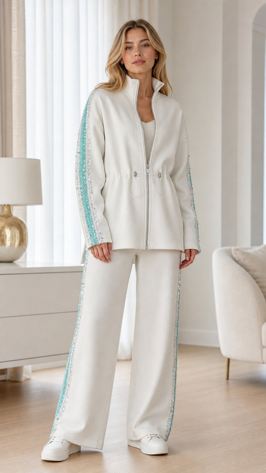 Front view of woman wearing white tracksuit set with sequin side stripe details
