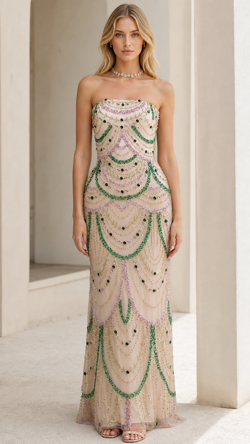 Front view of model wearing the champagne beaded strapless evening gown