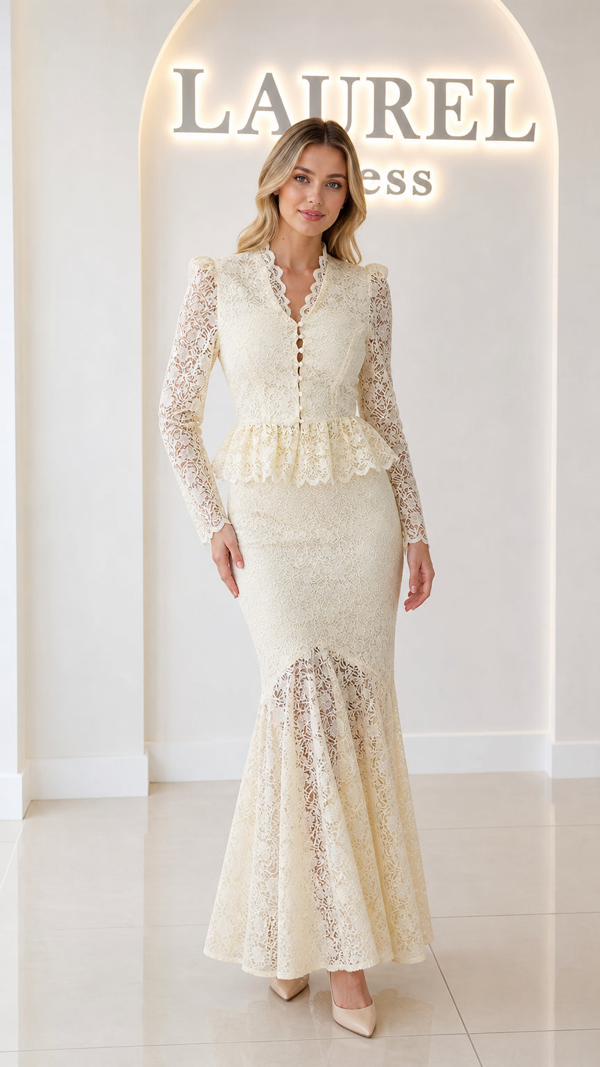Front view of model wearing ivory floral lace peplum mermaid maxi dress