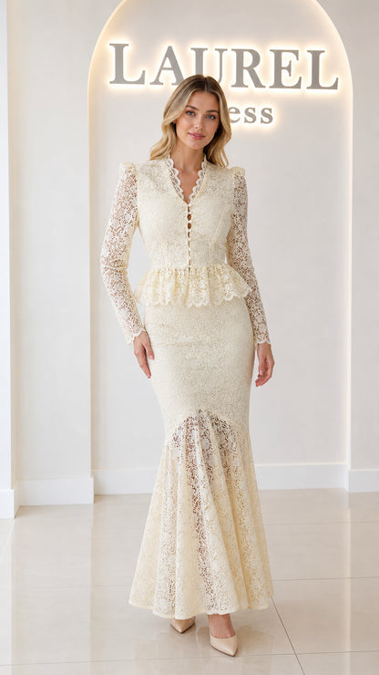 Front view of model wearing ivory floral lace peplum mermaid maxi dress