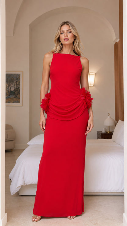 Model wearing red 3D floral open back maxi dress from the front