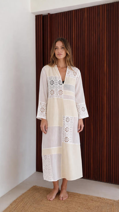 Model wearing white boho patchwork lace long sleeve maxi dress front view