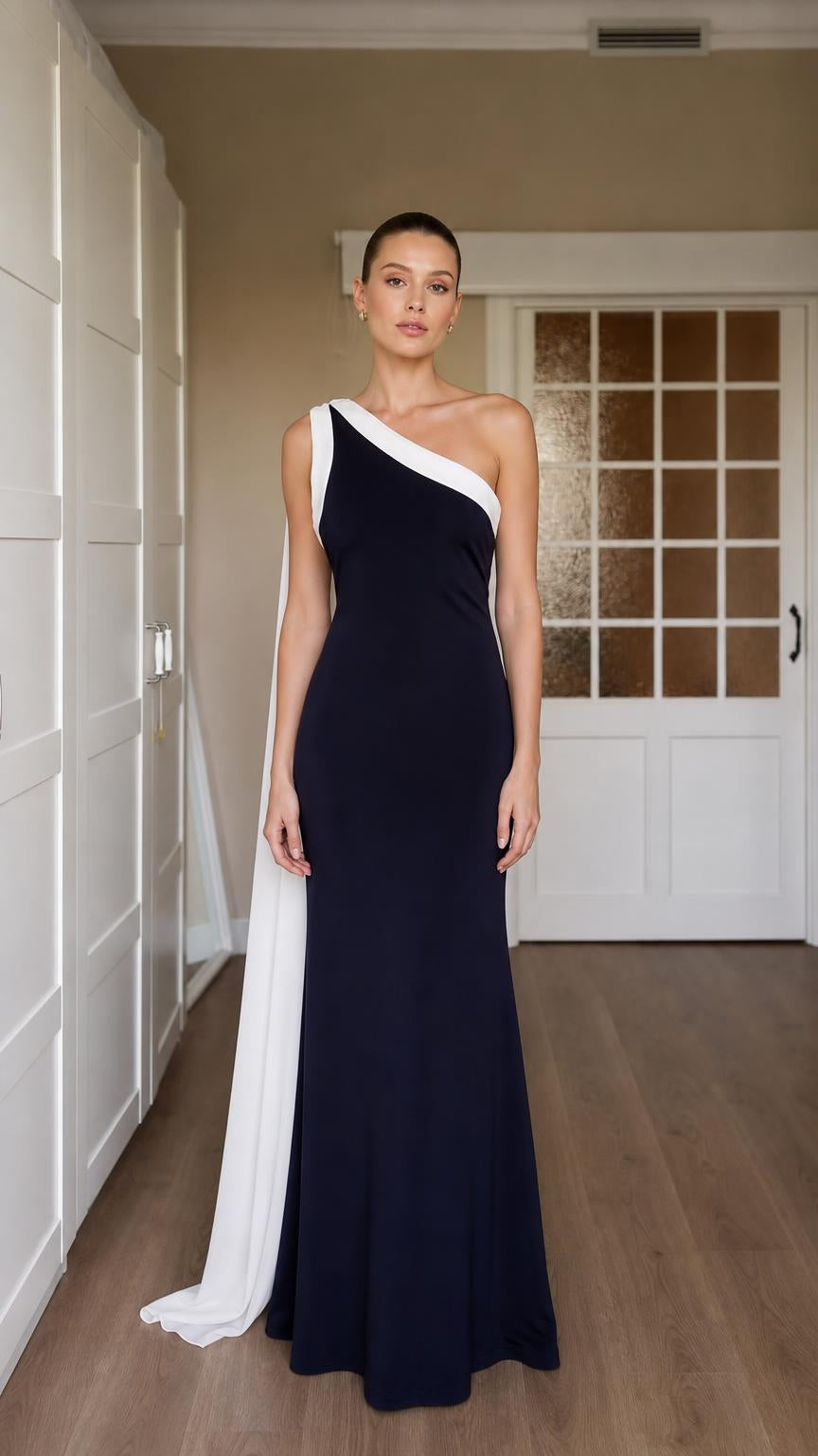 Front view of navy one-shoulder evening gown with white draped sash