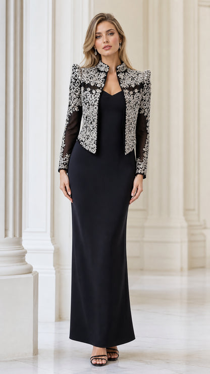 Front view of black column evening dress with silver embellished bolero jacket