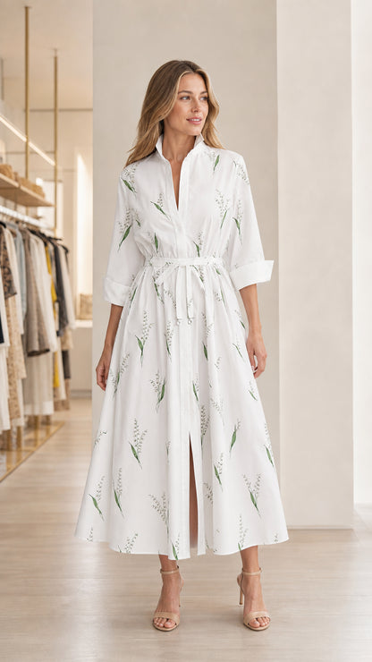 Front view of model wearing white floral midi shirt dress