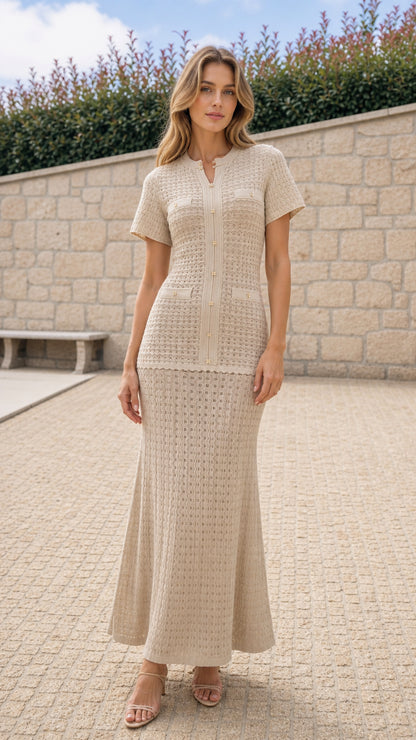 Model wearing beige textured knit top and maxi skirt set from the front