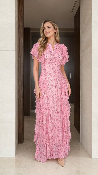 Model wearing pink floral ruffle maxi dress, front view