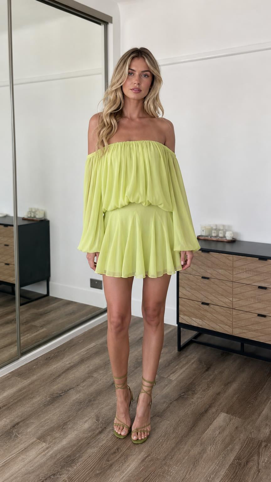 Front view of model wearing lime off-the-shoulder mini dress