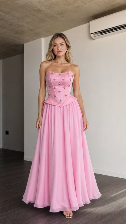 Front view of pink embellished corset strapless maxi dress