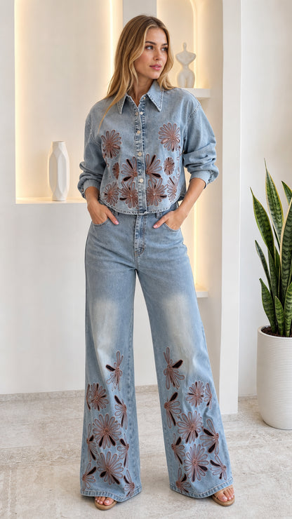 Model wearing light blue embroidered cutout denim shirt and wide-leg pants two-piece set front view