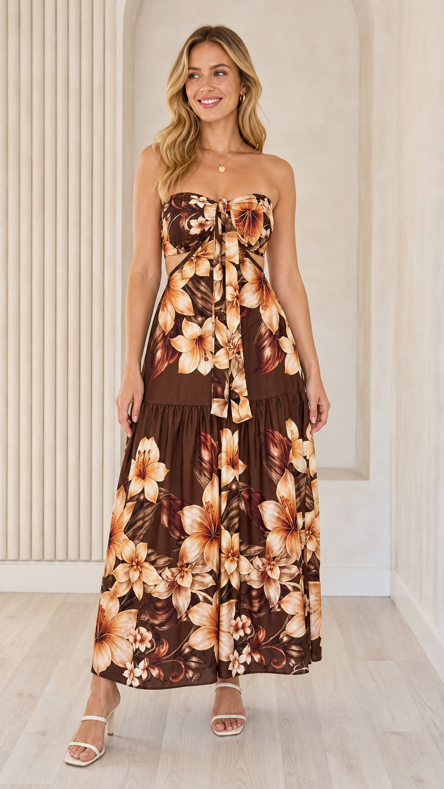 Front view of brown floral strapless maxi dress