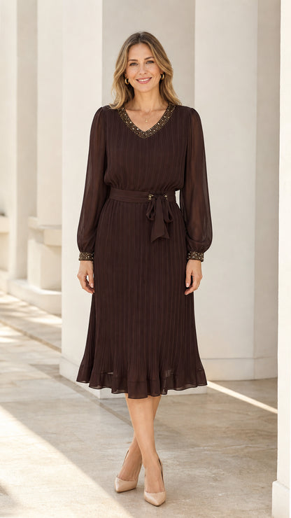 Front view of dark brown long sleeve pleated midi dress with beaded neckline