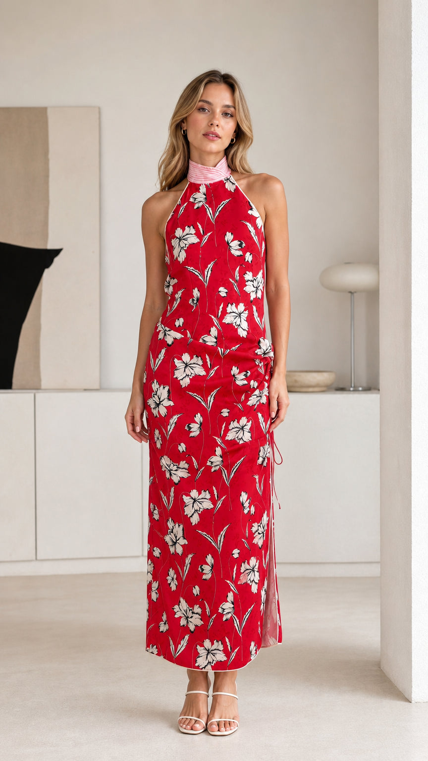 Front view of woman wearing red floral halter maxi dress
