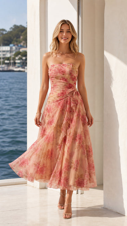 Model wearing peach floral strapless midi dress from the front