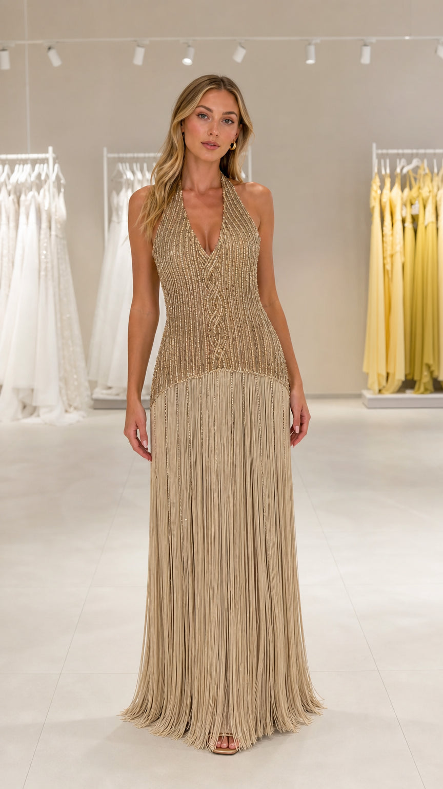 Front view of model wearing the Gold sequin beaded fringe halter maxi dress