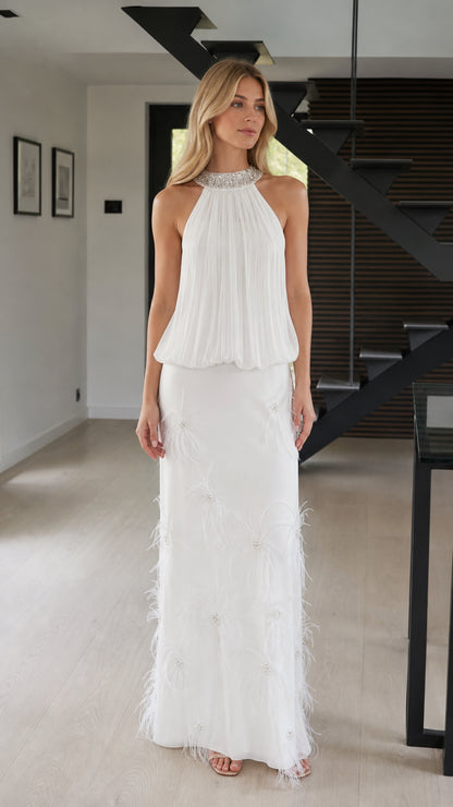 Front view of white embellished halter pleated maxi dress