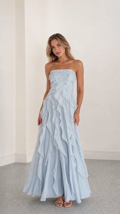 Front view of model wearing light blue strapless ruffle maxi dress