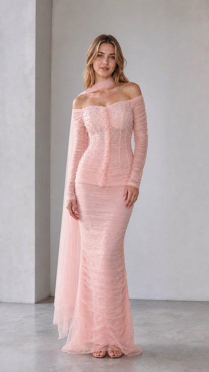 Blush pink embellished off-shoulder mermaid maxi dress shown from the front
