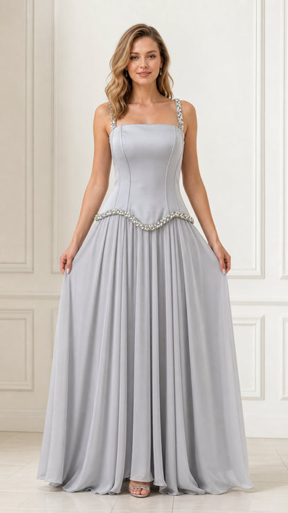 Full front view of a woman wearing a silver crystal-embellished chiffon evening maxi dress