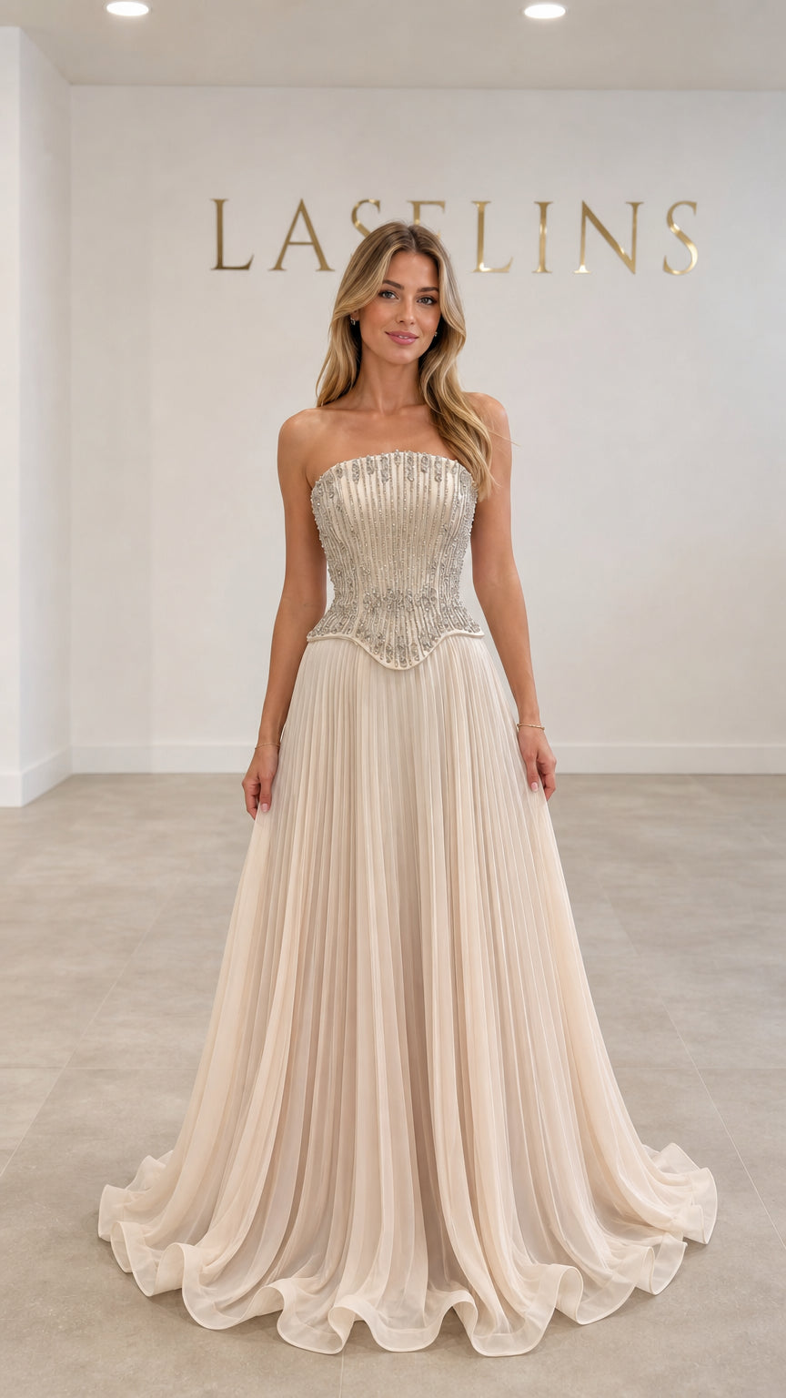 Champagne strapless beaded corset maxi evening gown with pleated skirt front view
