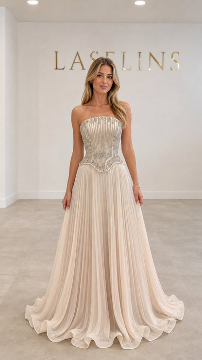 Champagne strapless beaded corset maxi evening gown with pleated skirt front view