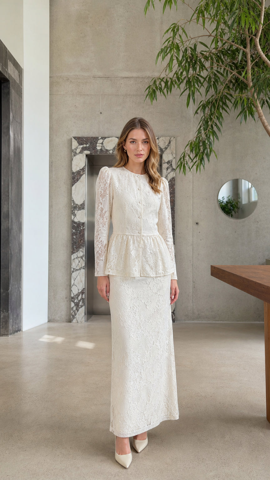 Full front view of model wearing the Cream floral lace peplum top and maxi skirt two-piece set