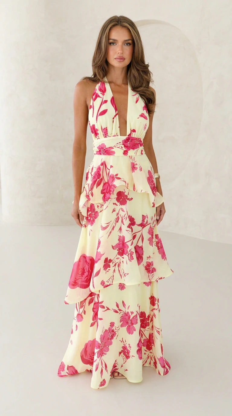 Front view of yellow floral halter neck maxi dress