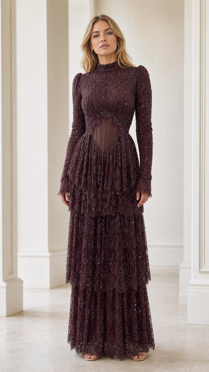 Front view of model wearing burgundy long sleeve embellished corset tiered evening maxi dress