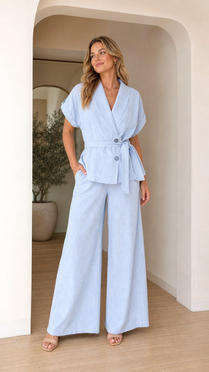 Front view of model wearing light blue two-piece blazer and wide leg pants set