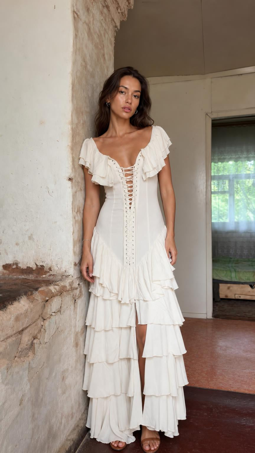 Front view of model wearing ivory bohemian ruffle tiered lace-up maxi dress