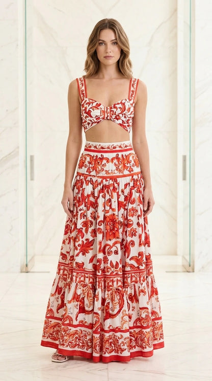 Front view of woman wearing red and white baroque print two-piece set