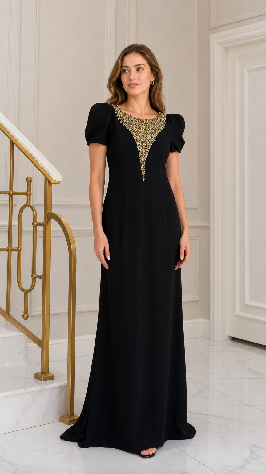Front view of woman wearing black floor-length evening gown with crystal rhinestone neckline and puff sleeves