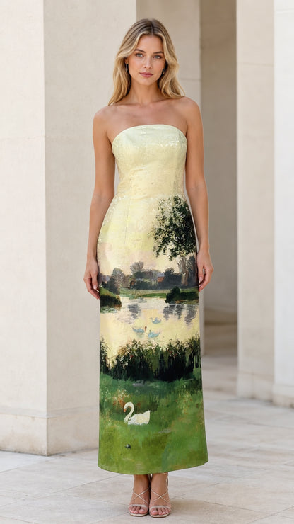 Front view of model wearing yellow landscape strapless maxi dress