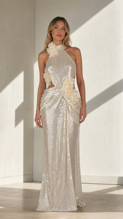Silver sequin halter maxi dress with floral appliqués shown from the front