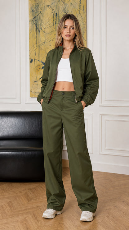 Full-body front view of woman wearing olive green bomber jacket and wide-leg pants set
