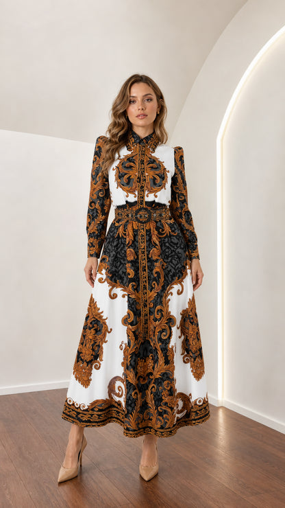 Model wearing long sleeve white and gold baroque print shirt maxi dress with belt front view