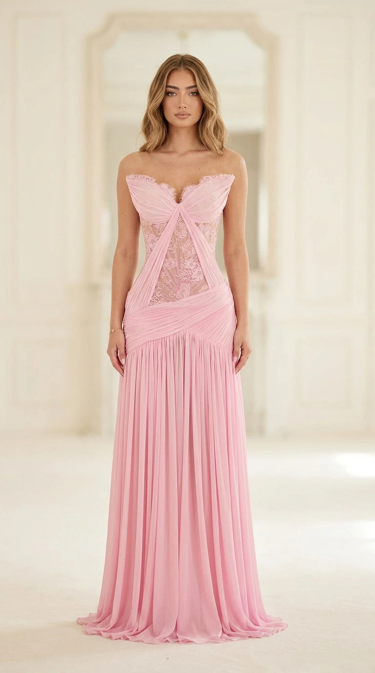 Front full-length view of model in pink strapless lace corset pleated evening gown