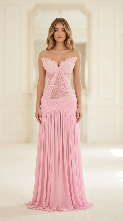 Front full-length view of model in pink strapless lace corset pleated evening gown