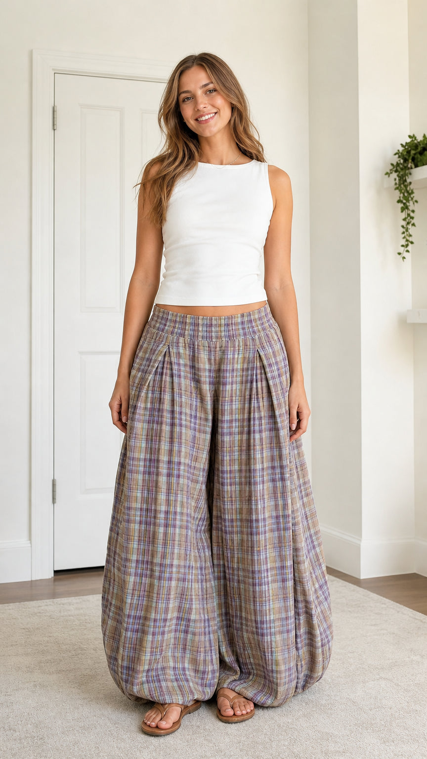 Front view of model wearing Lavender Plaid high-waisted lantern harem pants with white tank top