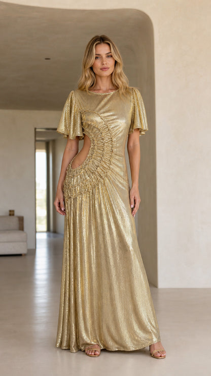 Front view of woman wearing a shimmering gold metallic maxi dress with cutout details
