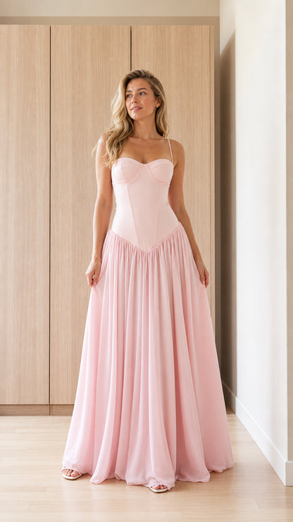 Front view of model wearing pink bustier maxi dress