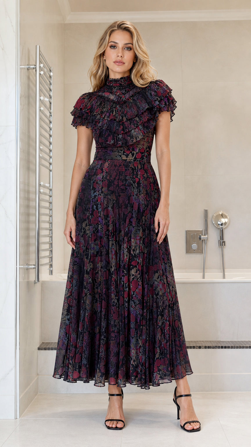Front view of model wearing dark multi ruffled high-neck pleated maxi dress