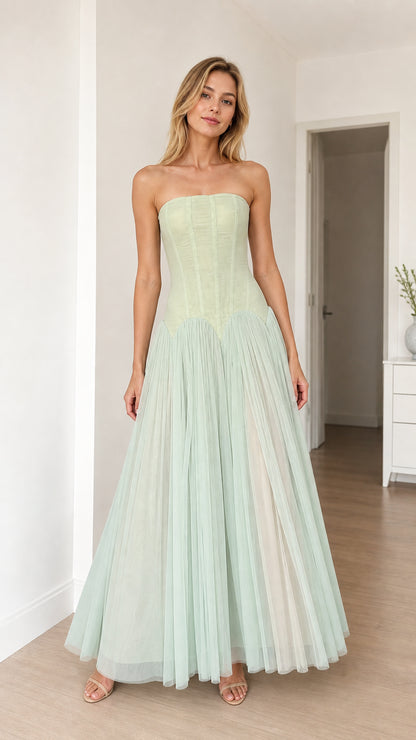 Model wearing sage green strapless corset tulle maxi dress, front view