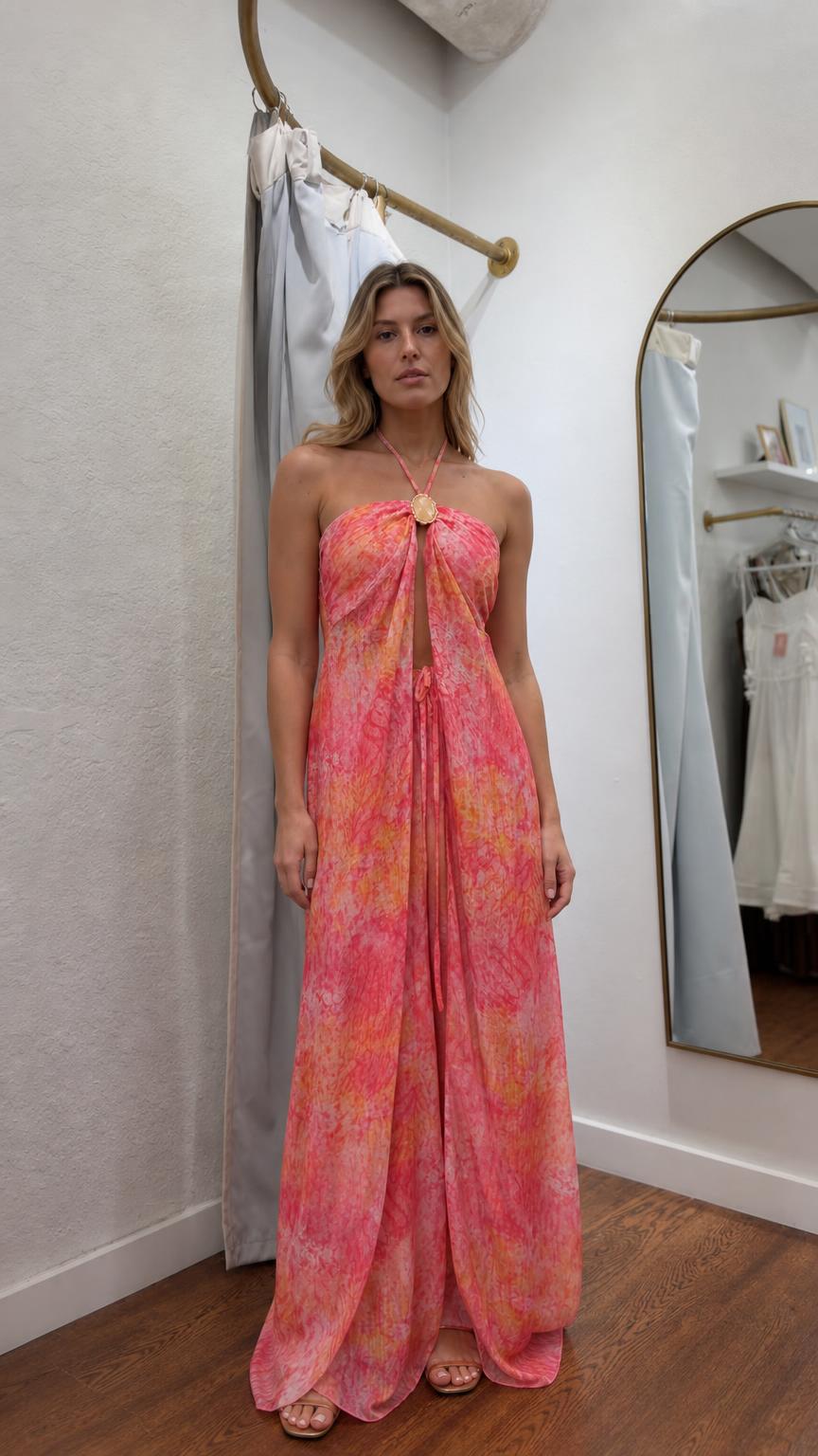 Model wearing pink boho halter maxi dress from the front