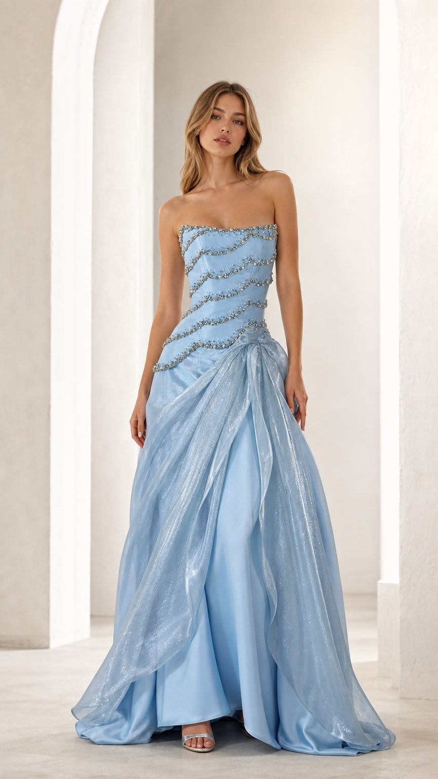 Front view of woman wearing sky blue strapless beaded evening gown