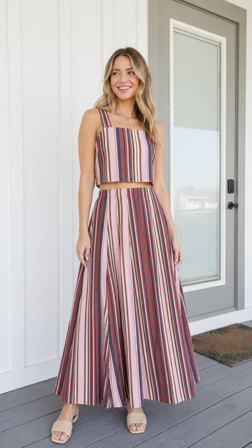 Front view of woman wearing pink striped two-piece set
