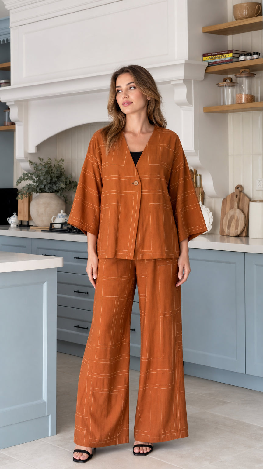 Front view of model wearing Rust relaxed 2-piece kimono top and wide-leg pants set