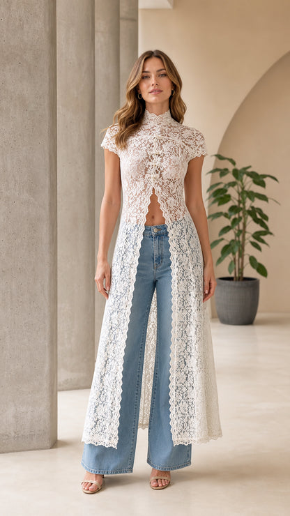Front view of woman wearing white lace long duster cardigan with jeans