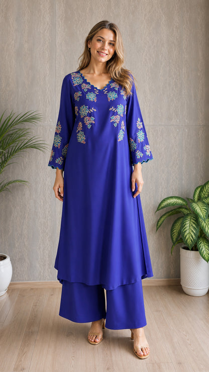 Model wearing royal blue embroidered tunic and wide-leg pants set, front view