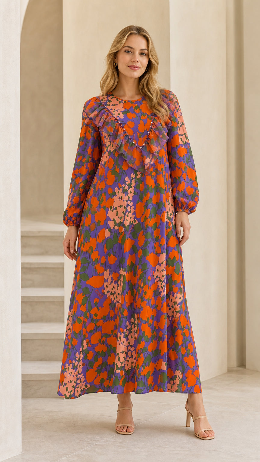 Full front view of model wearing purple floral long sleeve ruffle maxi dress